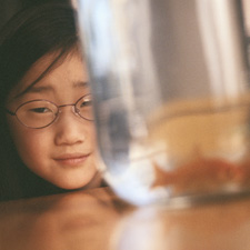 girl and goldfish bowl